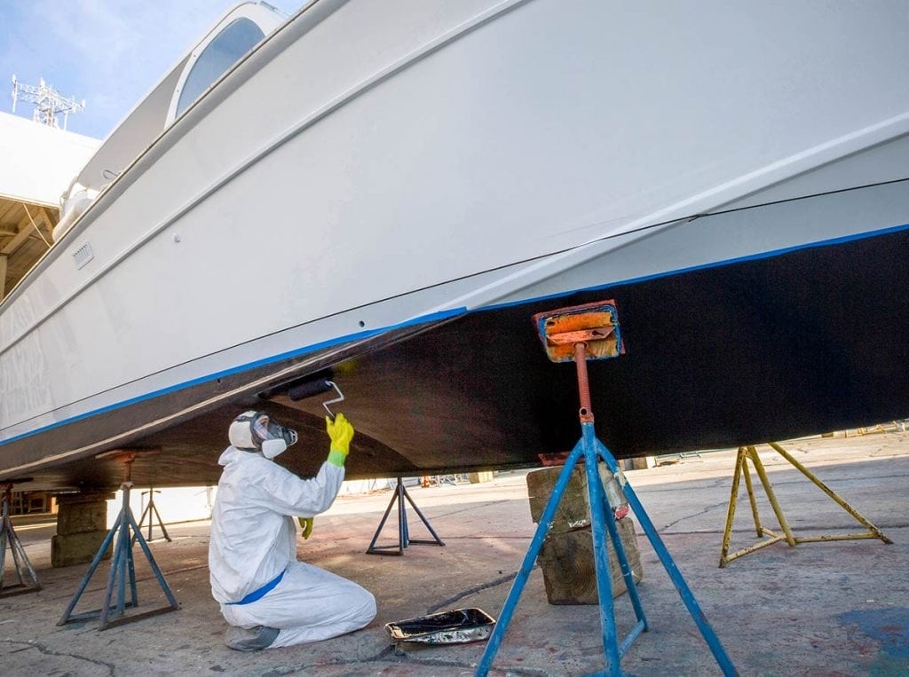 Applying antifouling bottom paint to a boat hull
